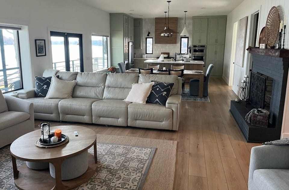 Family room including open view of dining table into kitchen
