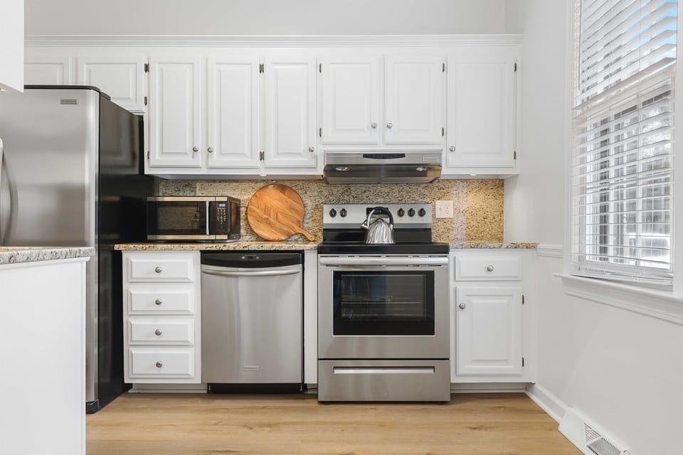 Whip up your favorite meal in the fully stocked kitchen with stainless steel appliances.