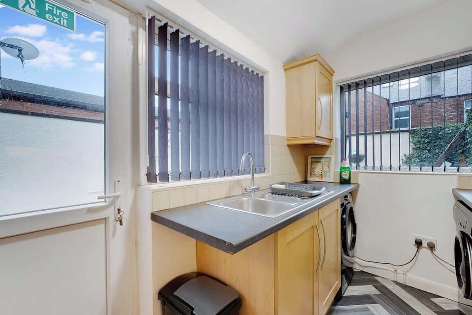 Kitchen equipped with all essentials, including a washer & dryer, oven, fridge and full cookware set.