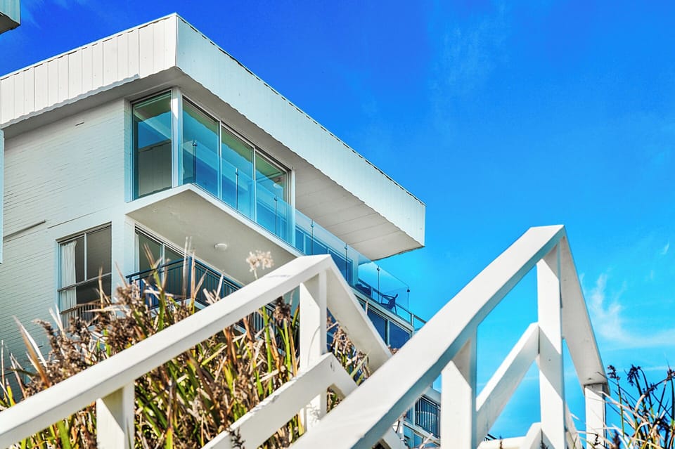 Penthouse with access to beach path.