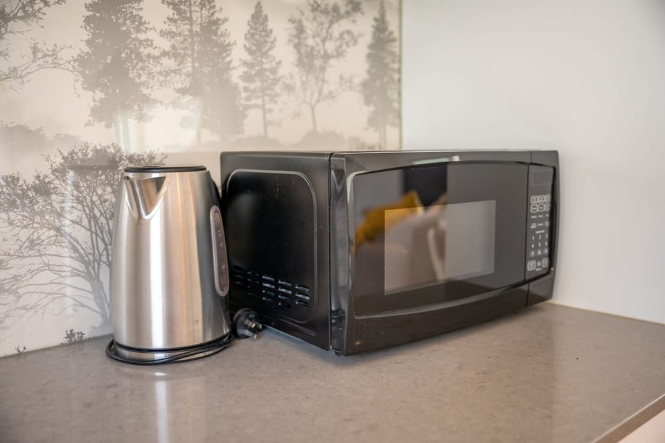 Kitchen amenities microwave and kettle
