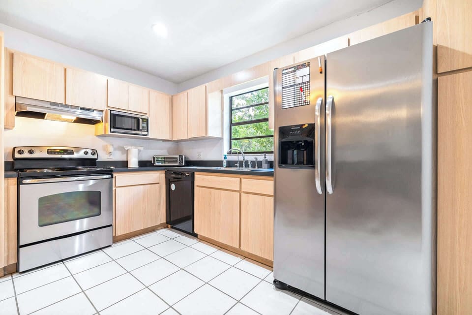 The open kitchen offers ample space & all the comforts of home