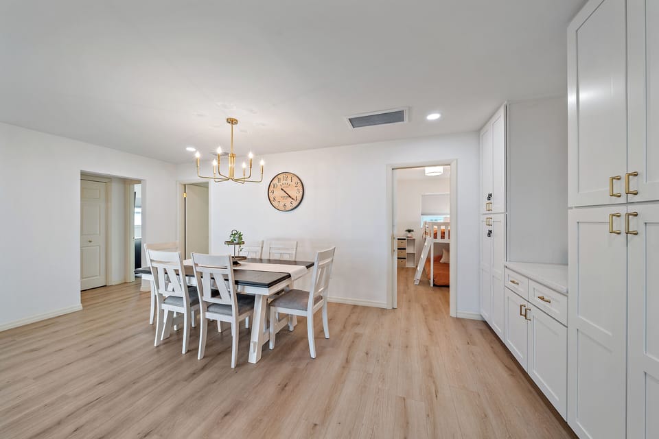 Gather around this gorgeous dining room table for a wonderful meal in! You can also see the doorway to bedroom 4 here.