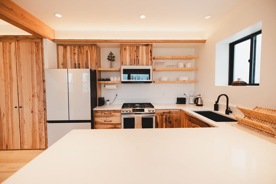 The kitchen wouldn't be complete w/out a window keeping your gaze on the slopes!