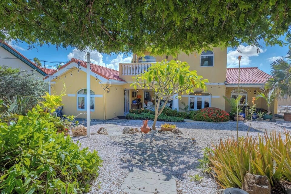 Charming home surrounded by lush gardens for a peaceful and relaxing stay.