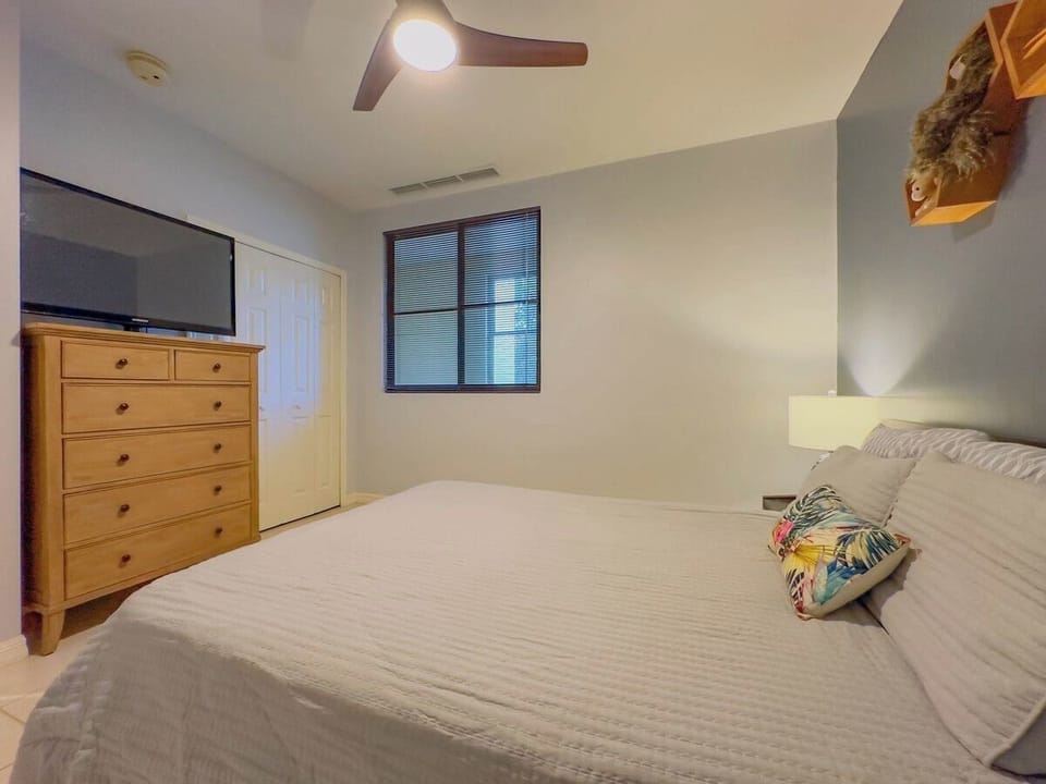 The second bedroom has a queen bed and lots of storage.