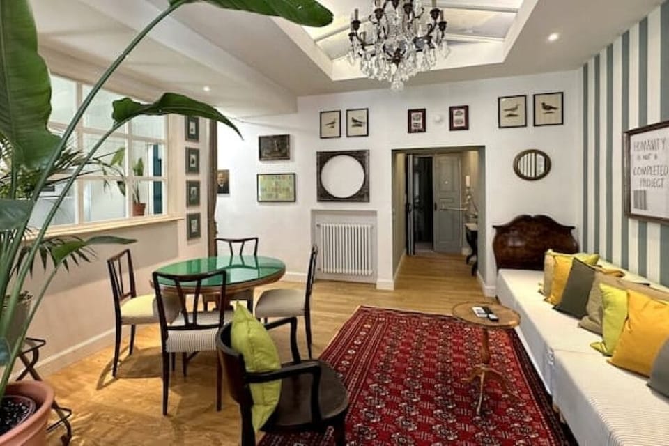 Living room with dining table and two single sofa beds 