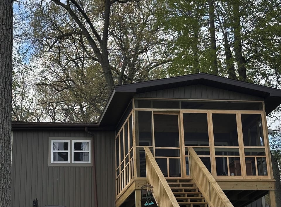 A 2-season room where you can enjoy the lake under a scored and screened porch