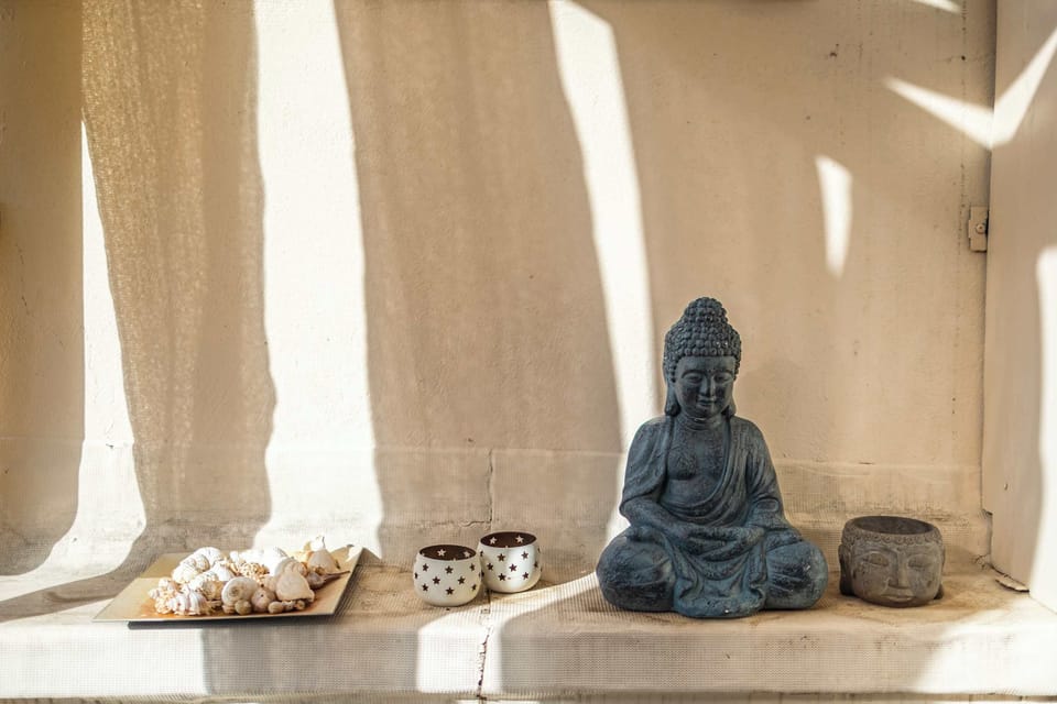 Stone Buddha Niche and Natural Texture Elements – A Tranquil Corner of the Property


