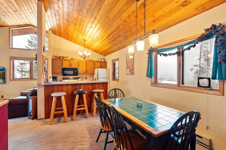 Gather around the table and let the good times roll in this inviting space.