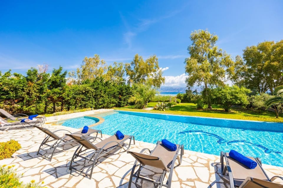 Private pool, terrace, and garden with sea views