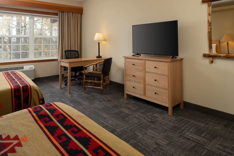 Settle in with a big TV and a dedicated work desk