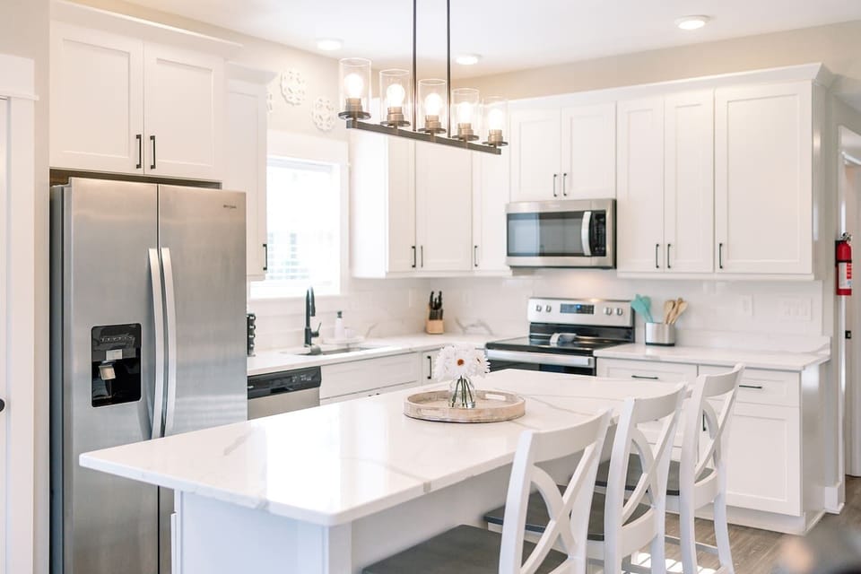Bright kitchen featuring stainless steel appliances.