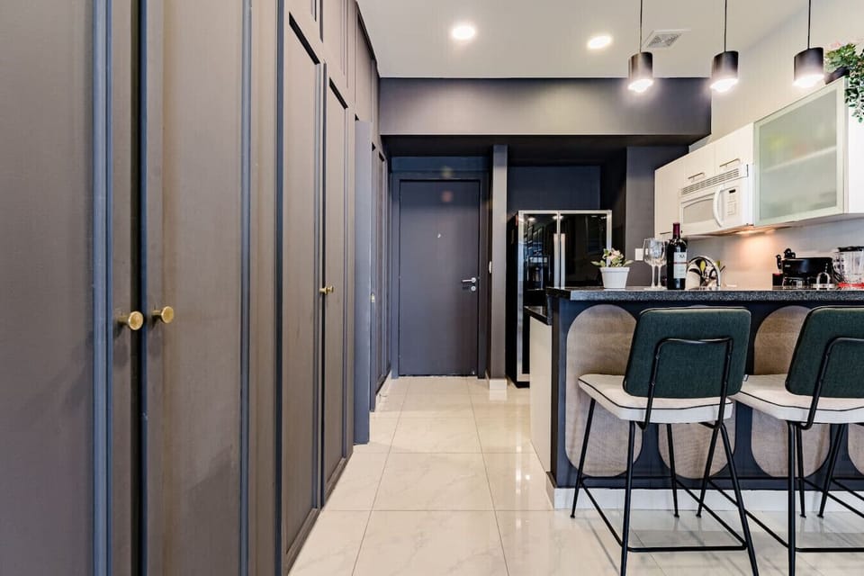 Open-plan kitchen and dining area with a sleek, modern design.