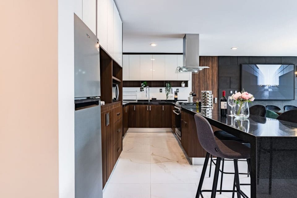 Fully equipped kitchen with high-end appliances and plenty of counter space, making meal prep a breeze.