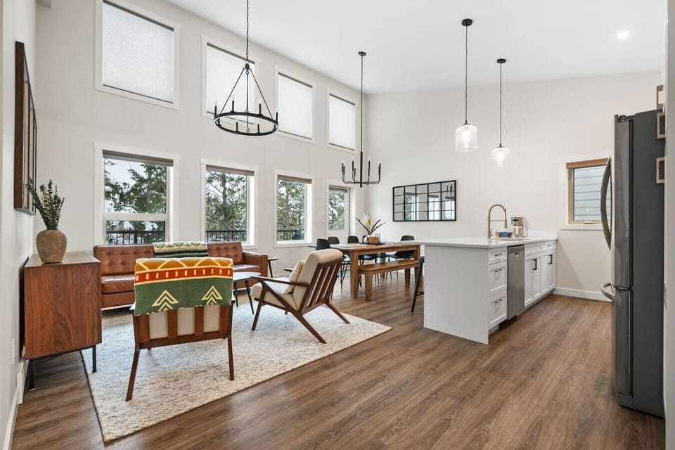 Beautifully designed living room on the main floor with cozy seating and plenty of natural lighting.