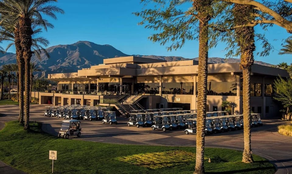 Arrive at a grand desert resort backed by rugged peaks.