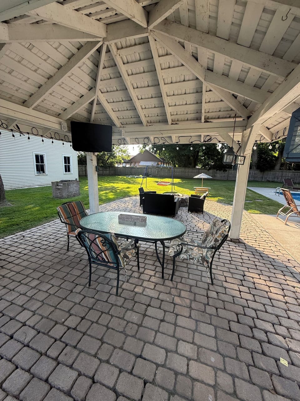 Outdoor dining area with a TV to watch the big game! 
