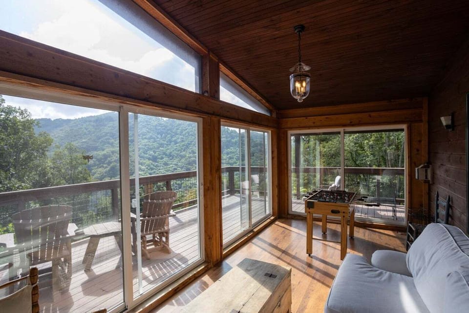 Sunroom with Doors Opening to the Deck and Foosball Table