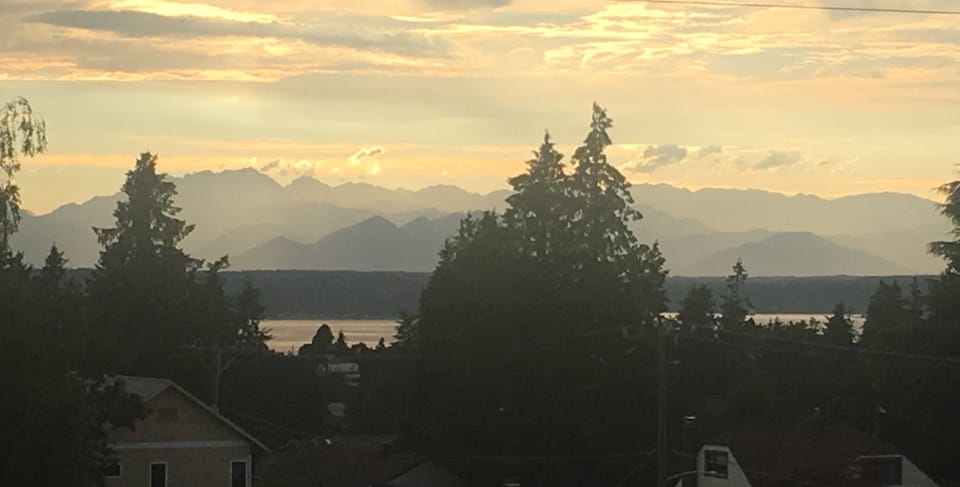 Sunset views backlight the Olympic Mountains