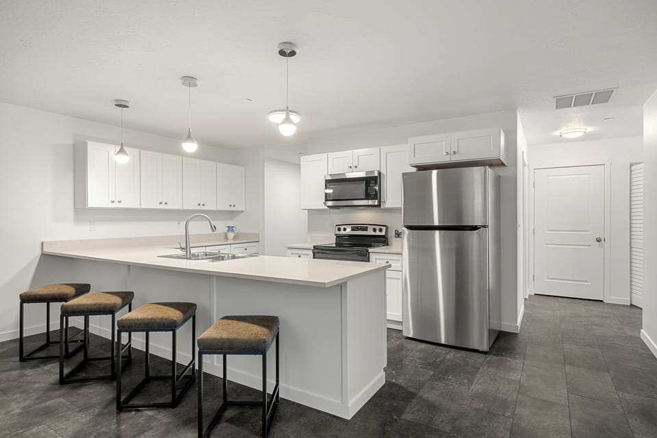 Large kitchen with full size appliances and large island.