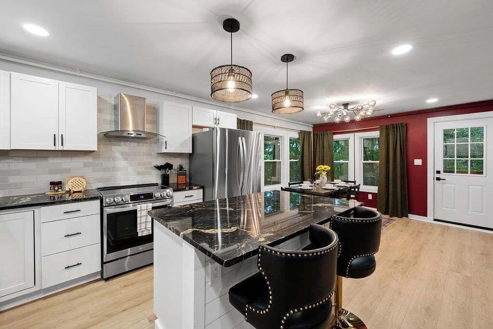 Our fully stocked kitchen, complete with modern lighting, offers the perfect space for creating culinary delights.