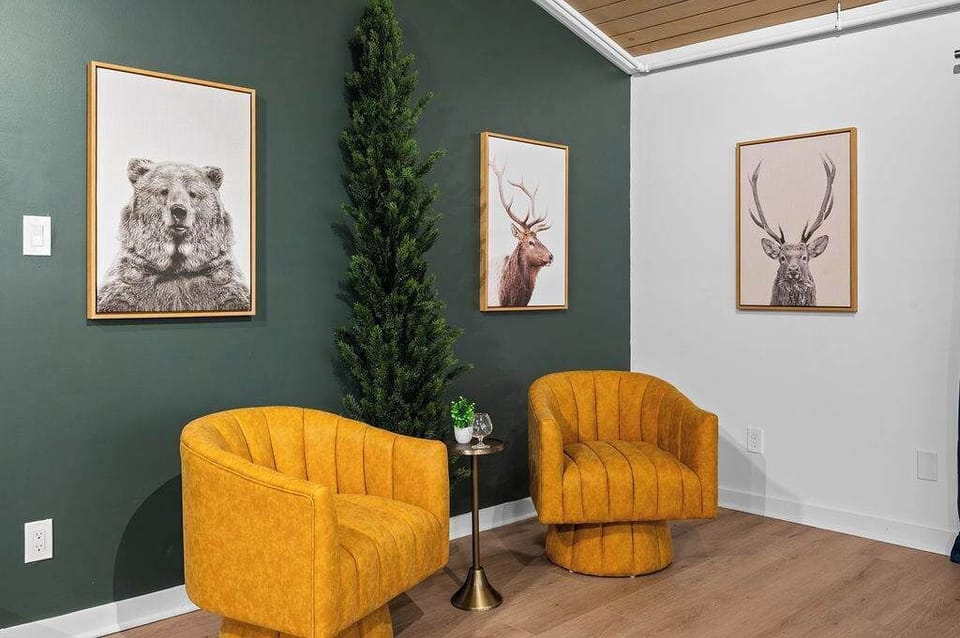 Celebrate the holidays in style with our cheerful yellow modern plush chairs framing a beautifully adorned Christmas tree