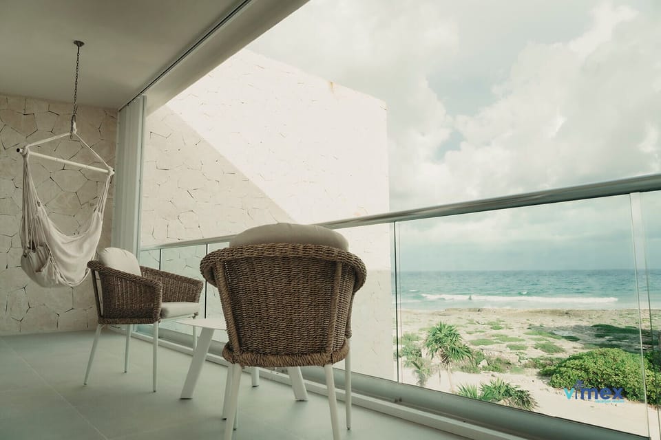 Coastal chic balcony; unwind with ocean breezes.