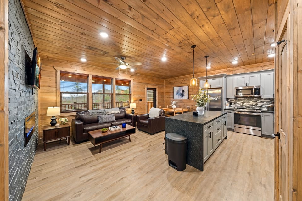 Comfortable seating, cozy fireplace, and stunning mountain views—your perfect spot to gather and relax.