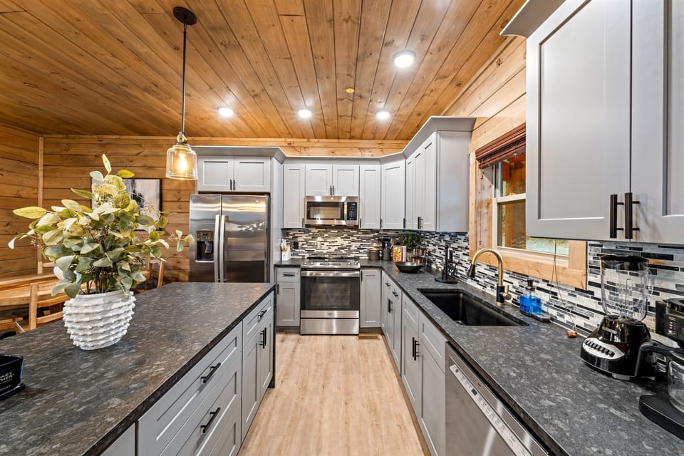 Fully equipped with modern appliances, this kitchen makes cooking and entertaining a breeze.