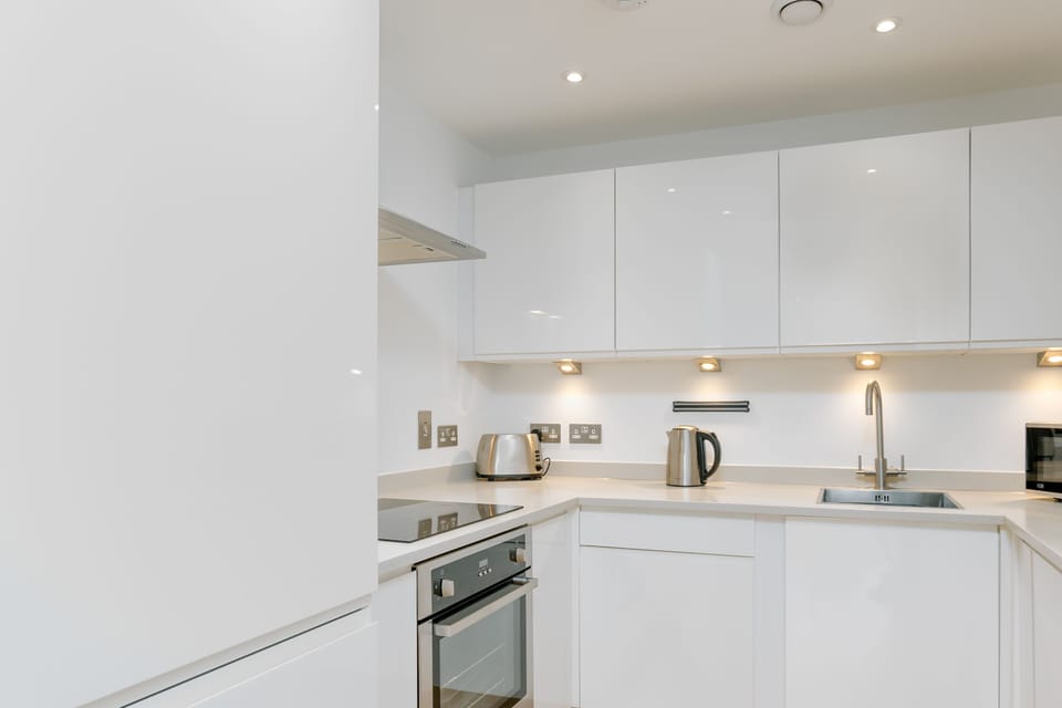 The kitchen benefits from a lot of storage & standing fridge freeze