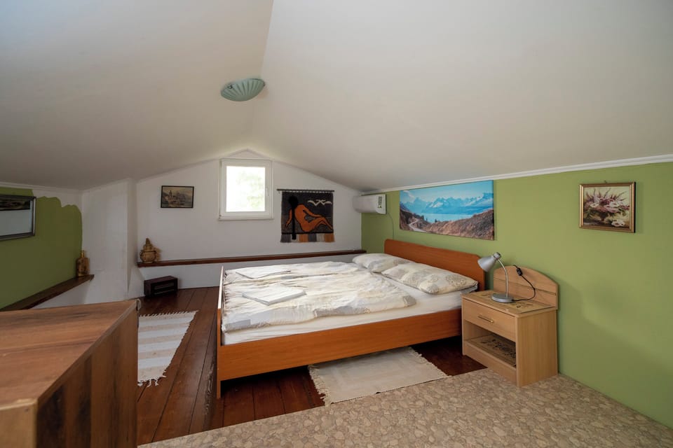 Loft bedroom featuring a queen-size bed.