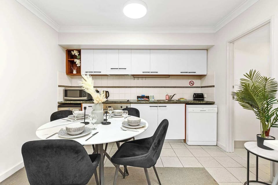 Our fully equipped kitchen and stylish dining area are ready for your culinary adventures, complete with a microwave, dishwasher, and all the essentials.