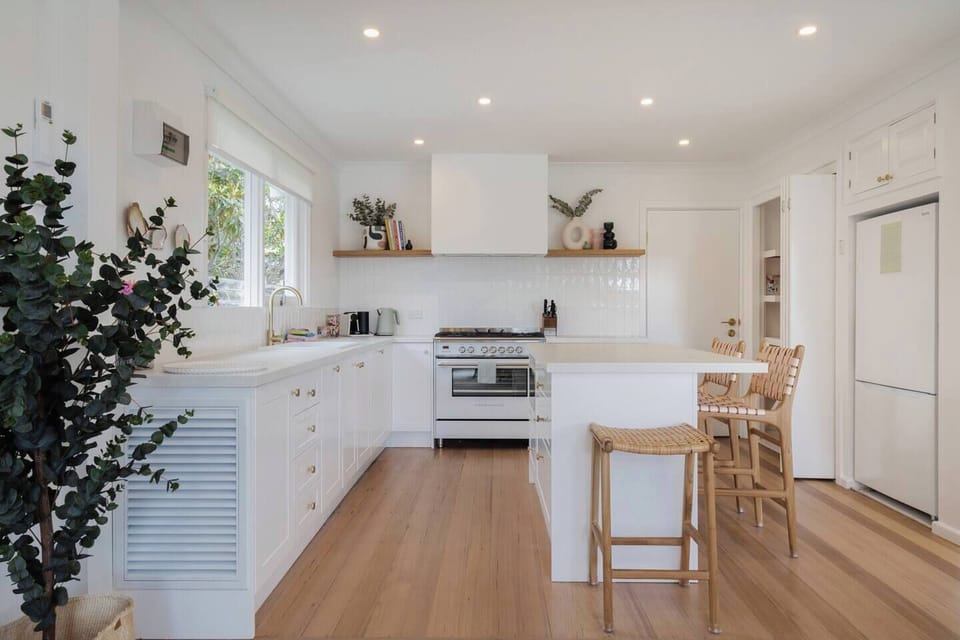 The modern kitchen is elegantly appointed with all you need to prepare meals at home, plus a dishwasher for easy clean-up.