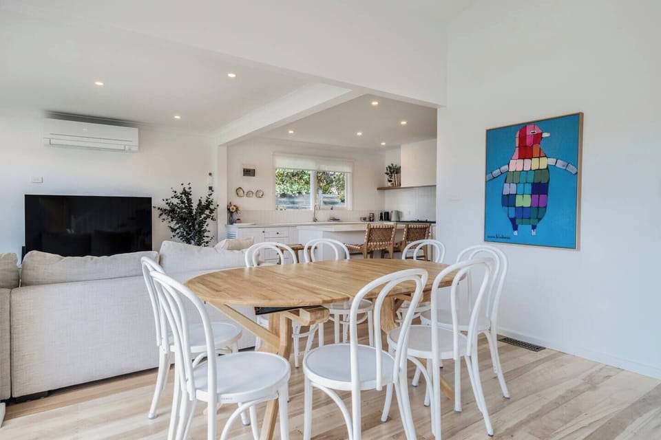 Share meals around the spacious, eight-seater dining table, with additional seating available at the breakfast bar.