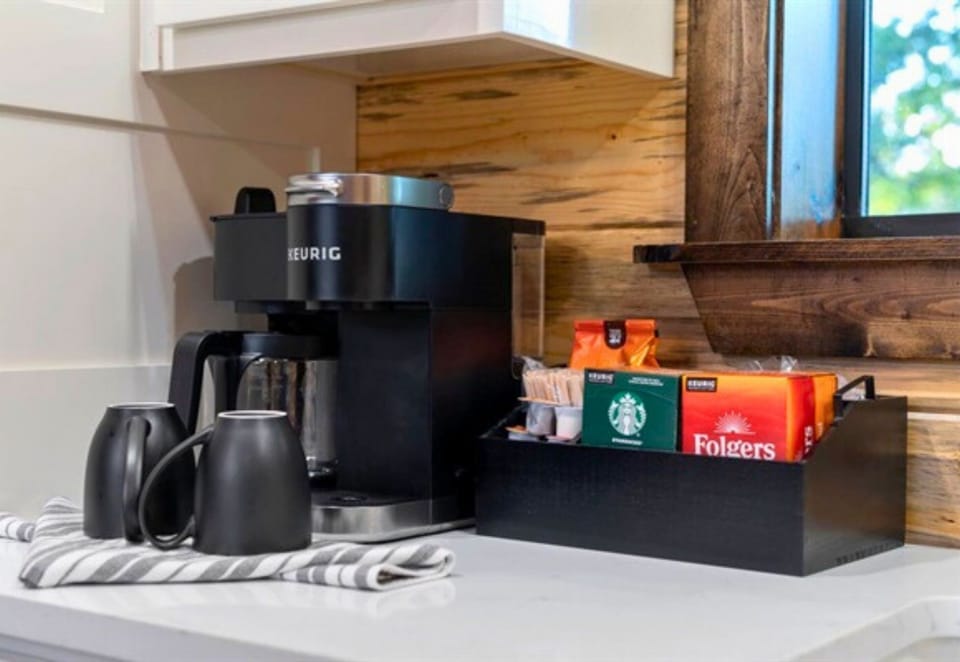 Start your mornings with ease at the coffee bar, complete with everything you need for your favorite brew.