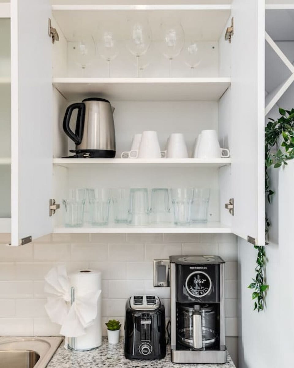 The coffee station is thoughtfully equipped with a variety of in-house consumables, including a selection of ground coffee, sweeteners, and creamers to suit every taste.