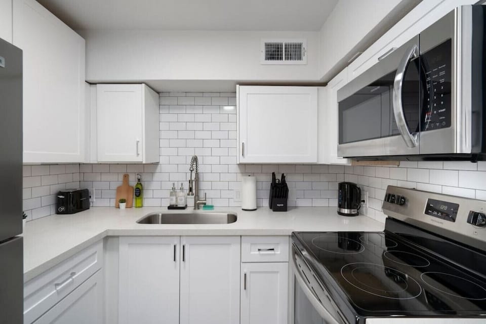 Fully equipped kitchen with all the tools you need for a perfect culinary experience. Enjoy the convenience of having everything at your fingertips!