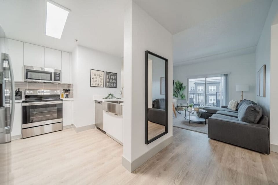An open-concept area featuring a modern furnishings, and a stylish entertainment setup—ideal for gatherings and relaxation.