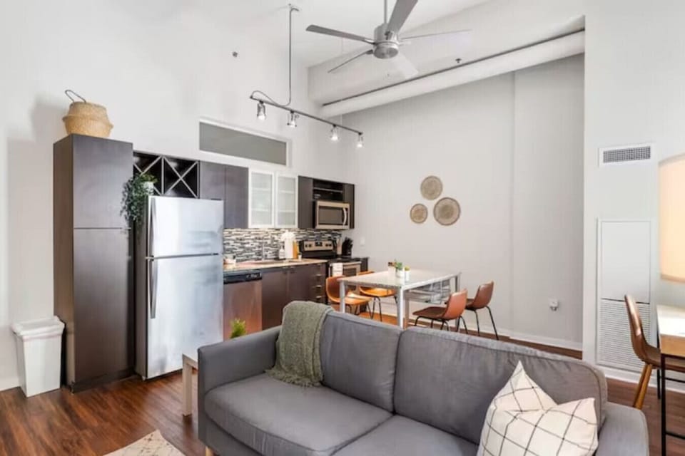 The living room’s cozy vibe makes it the perfect spot to relax, with ample seating and a warm ambiance.