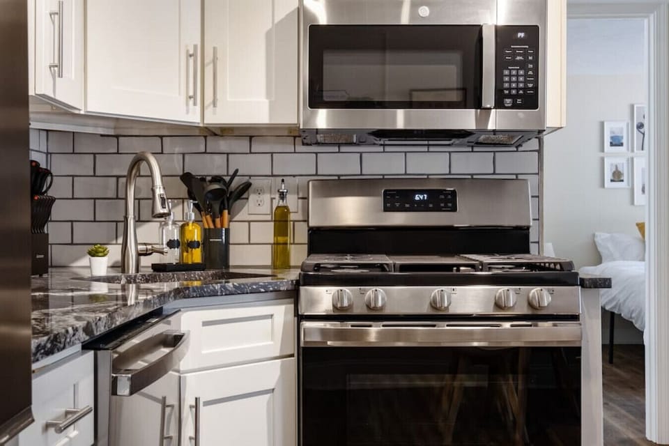 The kitchen’s open layout allows you to move freely as you prepare meals, with everything you need at your fingertips.