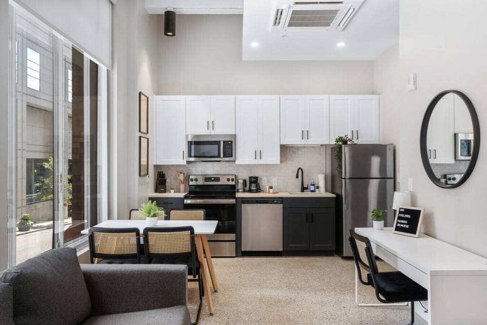 An open-concept area featuring a modern furnishings, and a stylish entertainment setup—ideal for gatherings and relaxation.