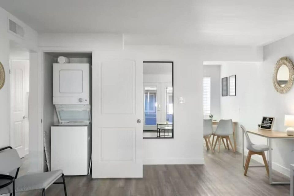Laundry room with a washer, dryer, and folding area, offering all the convenience you need for a comfortable extended stay.