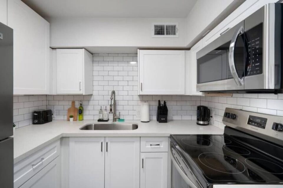 As you approach kitchen the elegant layout and well-stocked shelves make it the ideal spot to relax.