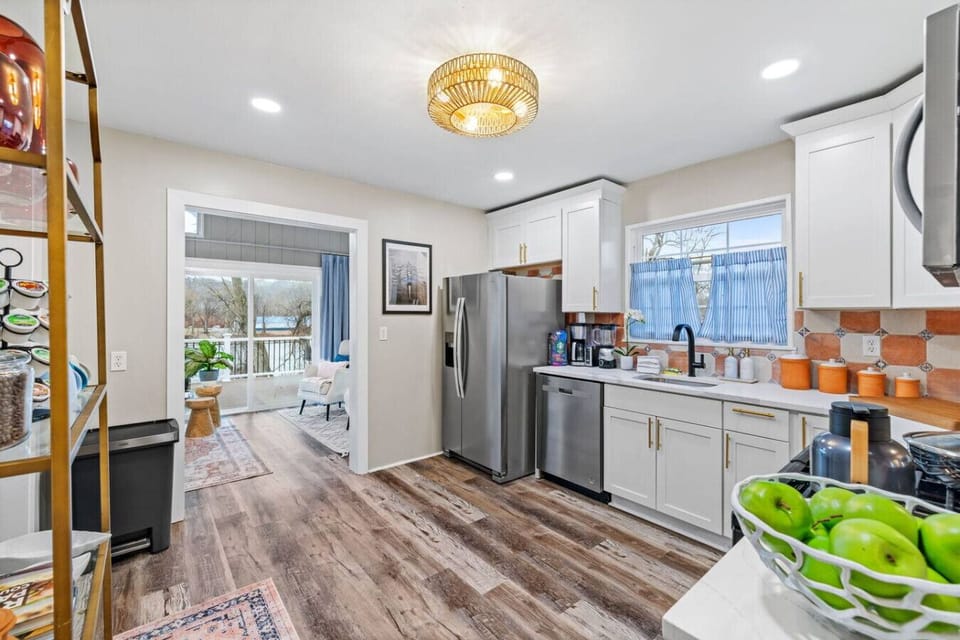 Bright and Open – The kitchen flows seamlessly into a cozy living room with river views, making meal prep feel like part of the getaway.