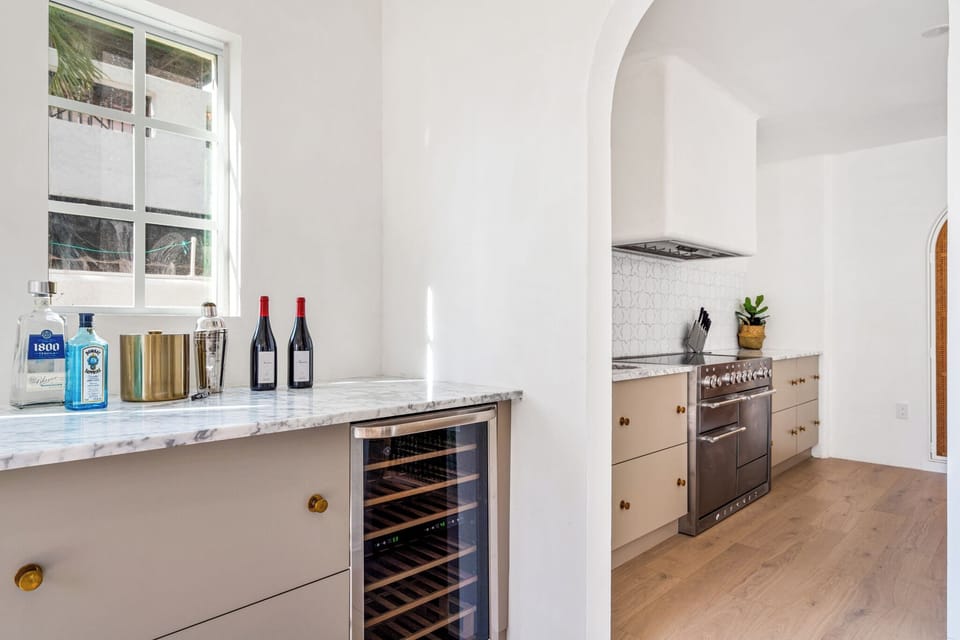 This wine cooler and wet bar area is right