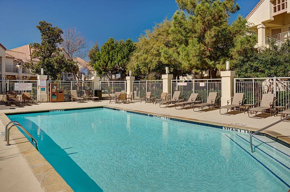 Unwind poolside under bright skies with plenty of loungers.