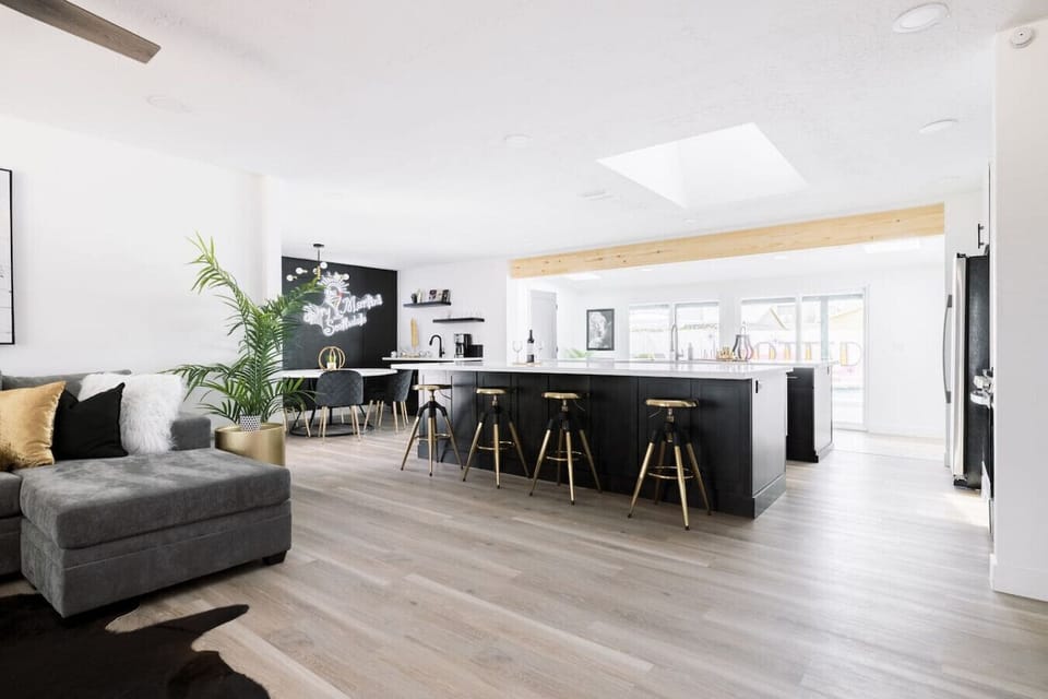 Spacious, modern kitchen with quartz countertops, two oversized islands, and a stylish coffee bar.