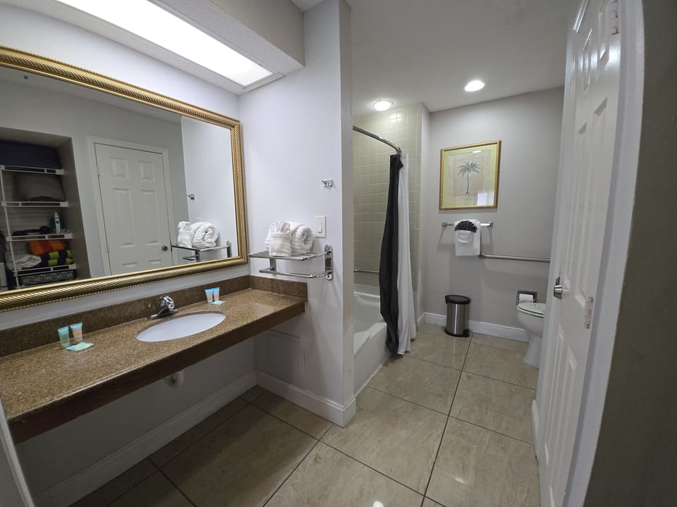 Relax in the bathtub or enjoy the shower —stocked with plenty of fresh towels in