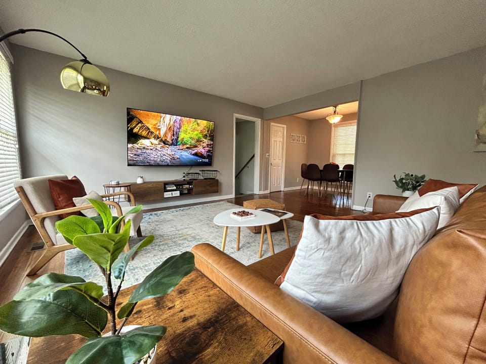 Living room with 75” smart TV where you can enjoy movie nights 